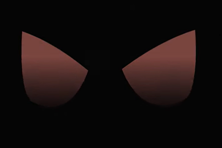 A frame from the same animation, showing two glowing shapes like eyes against a black background.
