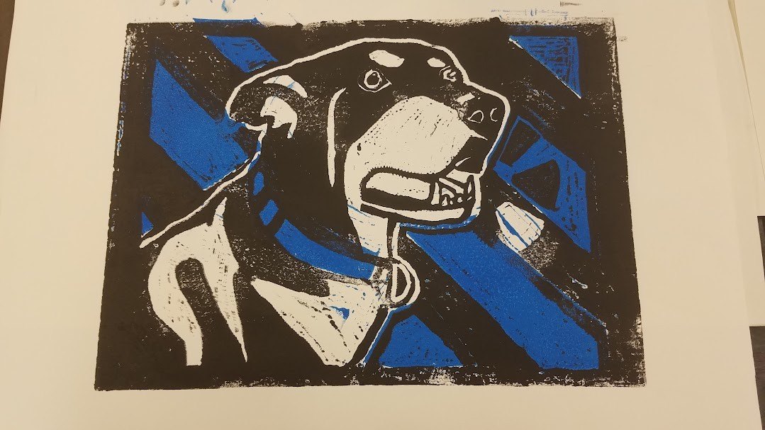 Sherman's printmaking artwork of his dog, in blue, black and white.