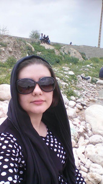 Reference photograph of Sherman's older half-sister, outdoors wearing sunglasses.